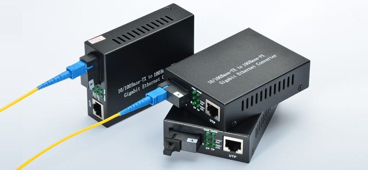 Two fibre media converters with fibre optic patch leads